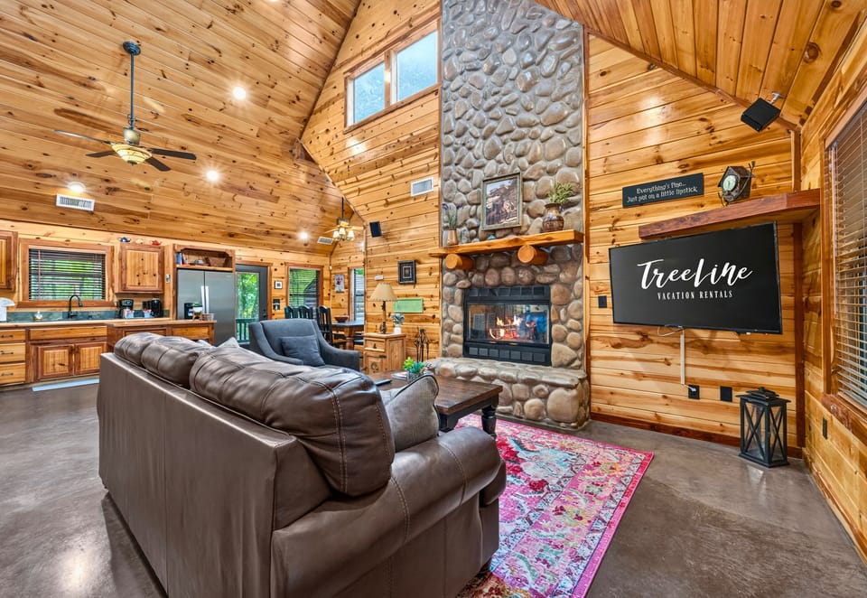 Whether you're watching a movie, catching up with family, or simply enjoying the crackling fireplace, this open living area makes it easy to feel right at home.