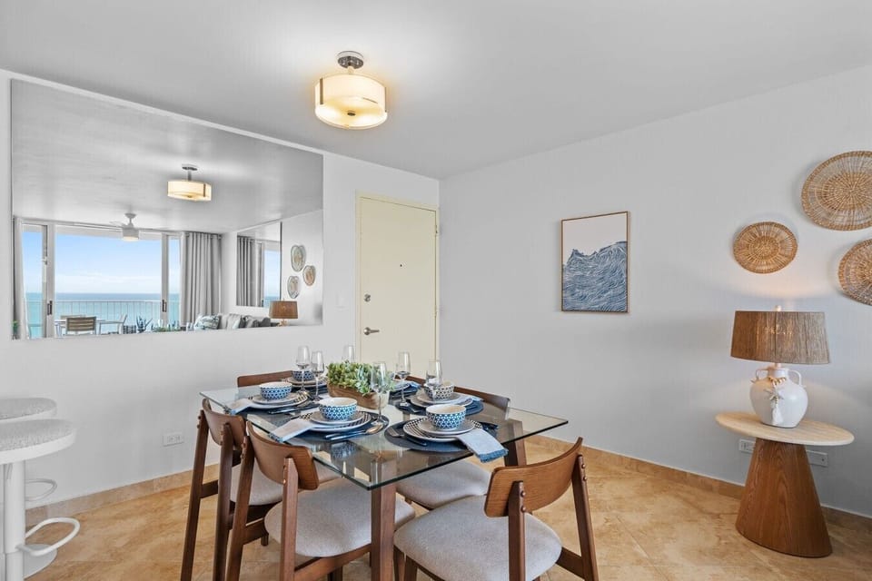 Open dining space with stylish coastal décor and a bright, airy feel.