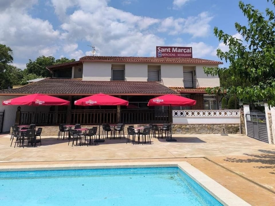 Seasonal outdoor pool, open 11:00 AM to 7:00 PM, pool umbrellas