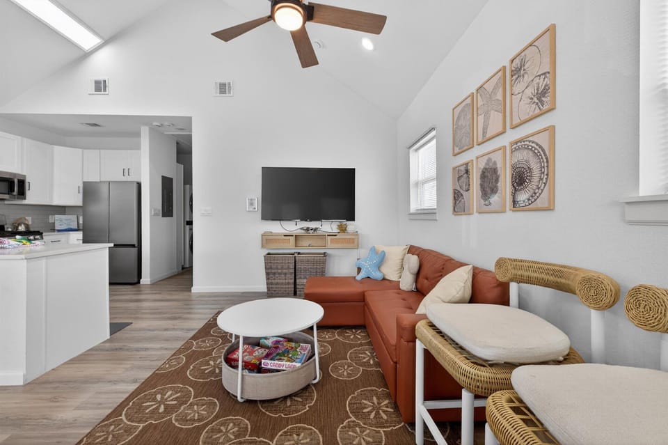 Bright living room with coastal charm and comfort.