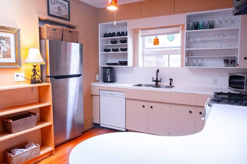 Character-filled kitchen with dishwasher and full-size fridge