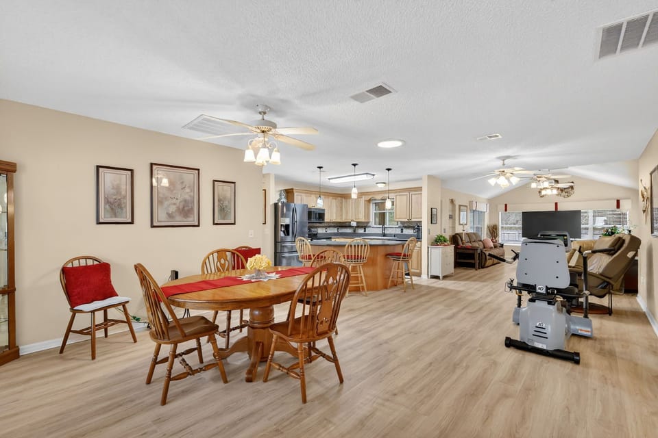Relax in this spacious open-concept living area where your family dinners and movie nights unfold seamlessly together.