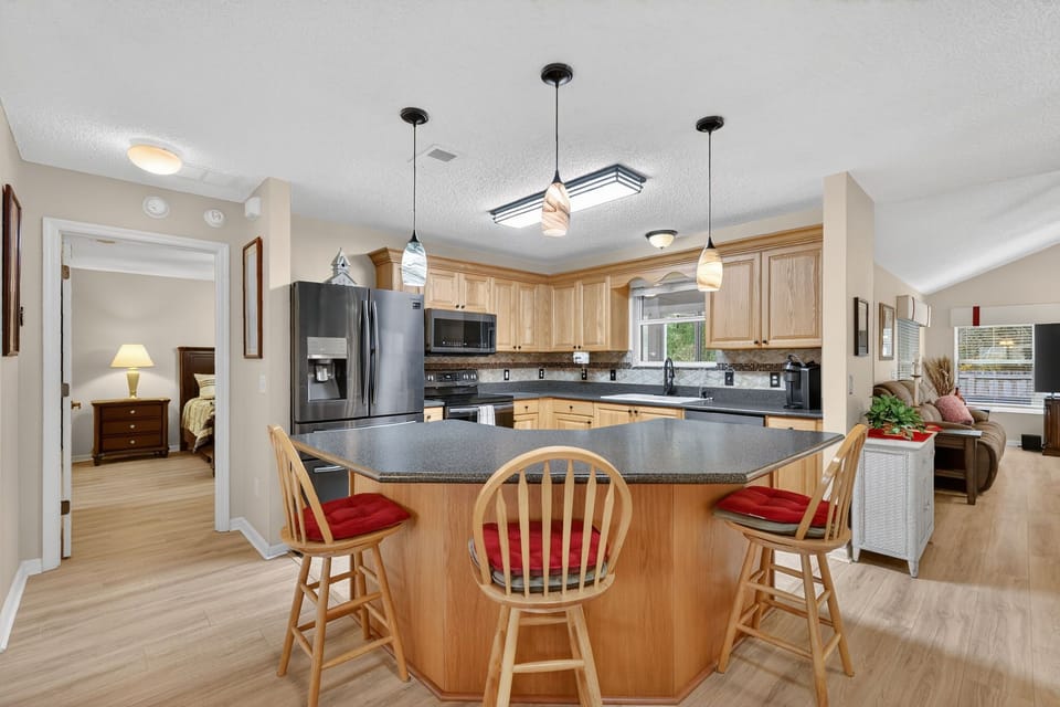 Gather around this spacious kitchen island where your group can cook, eat, and create memories together in this well-equipped culinary haven.