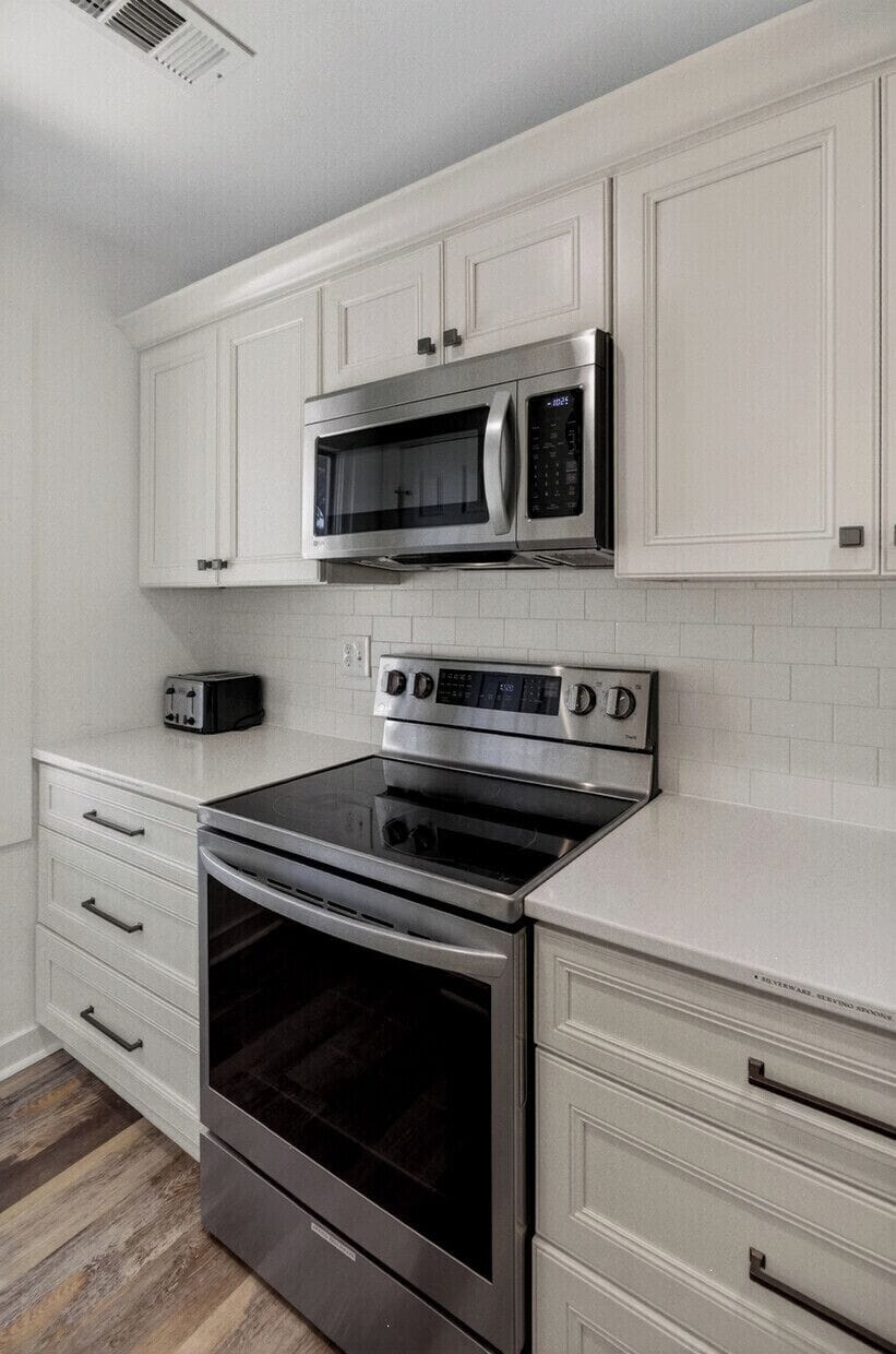 Your fully equipped kitchen features stainless steel appliances, ample counter space for meal prep, and a toaster ready for your morning routine.