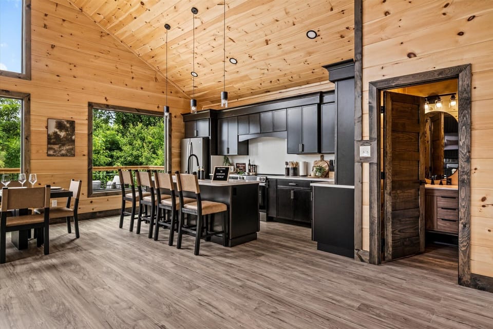 Fully stocked designer kitchen with room for the cooks and the crowd.