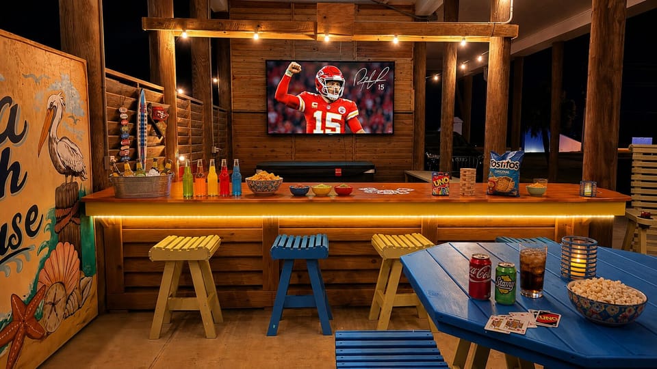 Watch the big game from the outdoor bar or while relaxing in the nearby hot tub—this covered entertainment space is perfect for gathering long after the sun goes down.