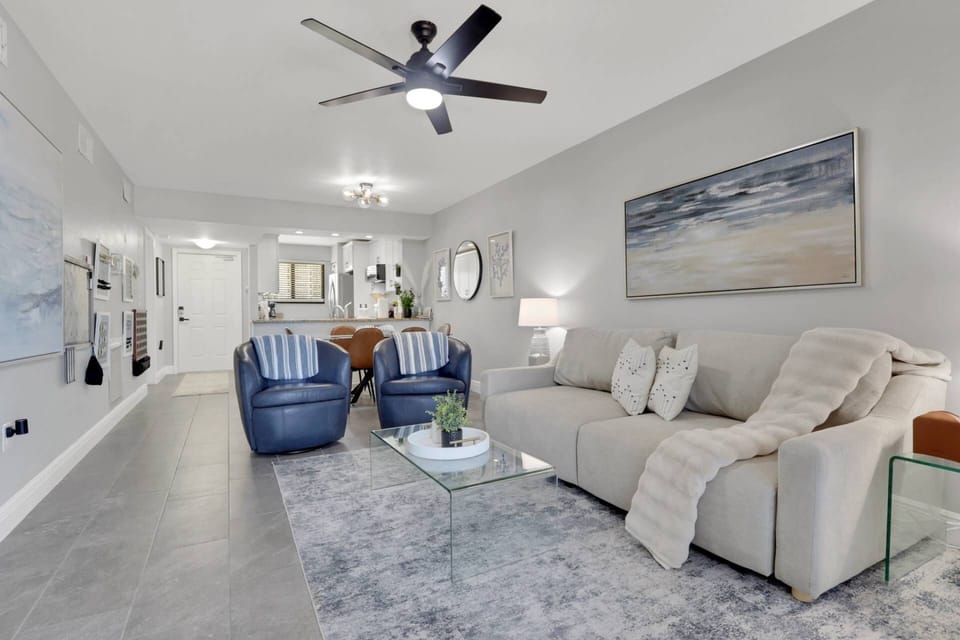 Beautifully updated with modern coastal décor, this open-concept living space is bright, inviting, and designed for effortless relaxation.