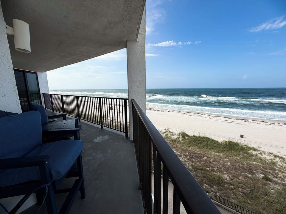 Panoramic Gulf and beach views from the private wraparound balcony