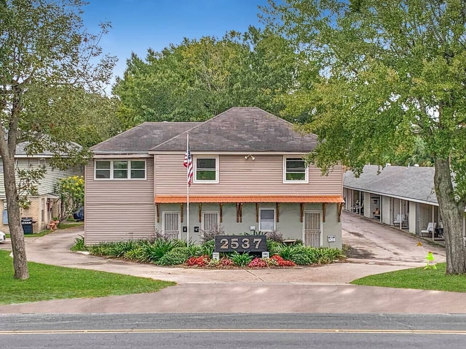 Step into serenity with our charming exterior and secluded courtyard, just a stone's throw from the tranquil Mississippi River levee.