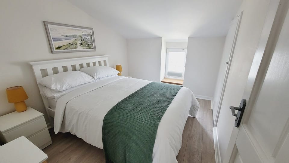 Bright, comfortable bedroom with fresh 100% cotton bedding and calming décor.
