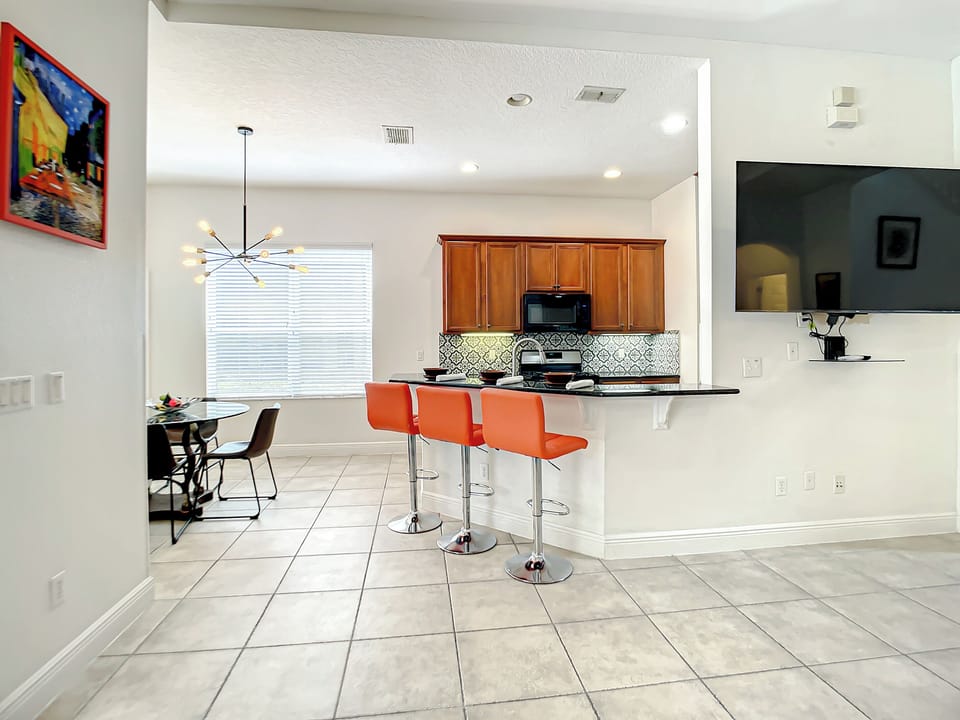 Kitchen & Dining Area: Bright and modern space with stylish seating and vibrant decor!