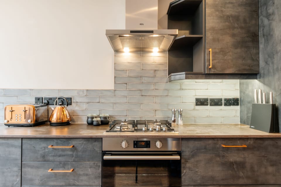 The stylish kitchen with a gas hob and electric oven