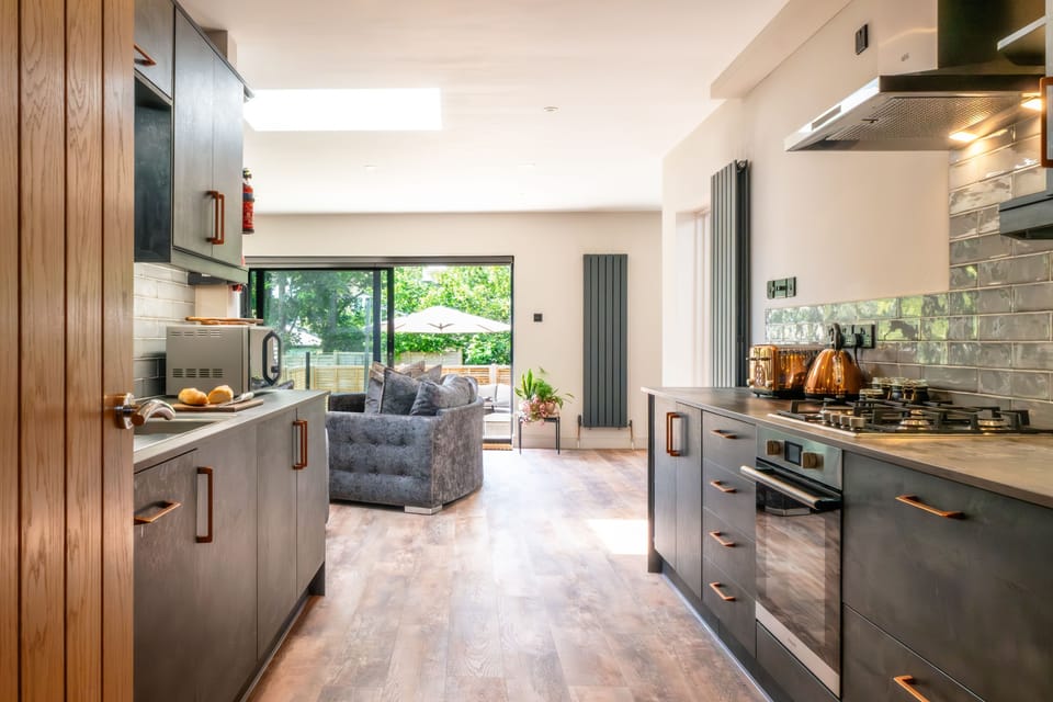 A spacious entrance hall leads through to the high-spec kitchen and open-plan living area