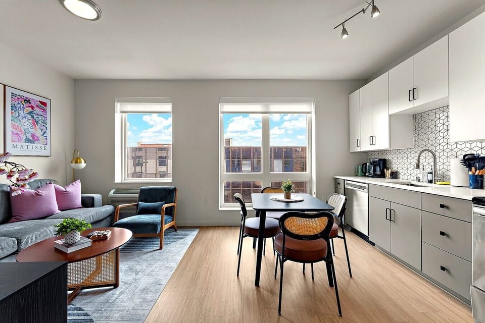 Bright open-concept living and dining area with stylish decor and a comfortable layout.