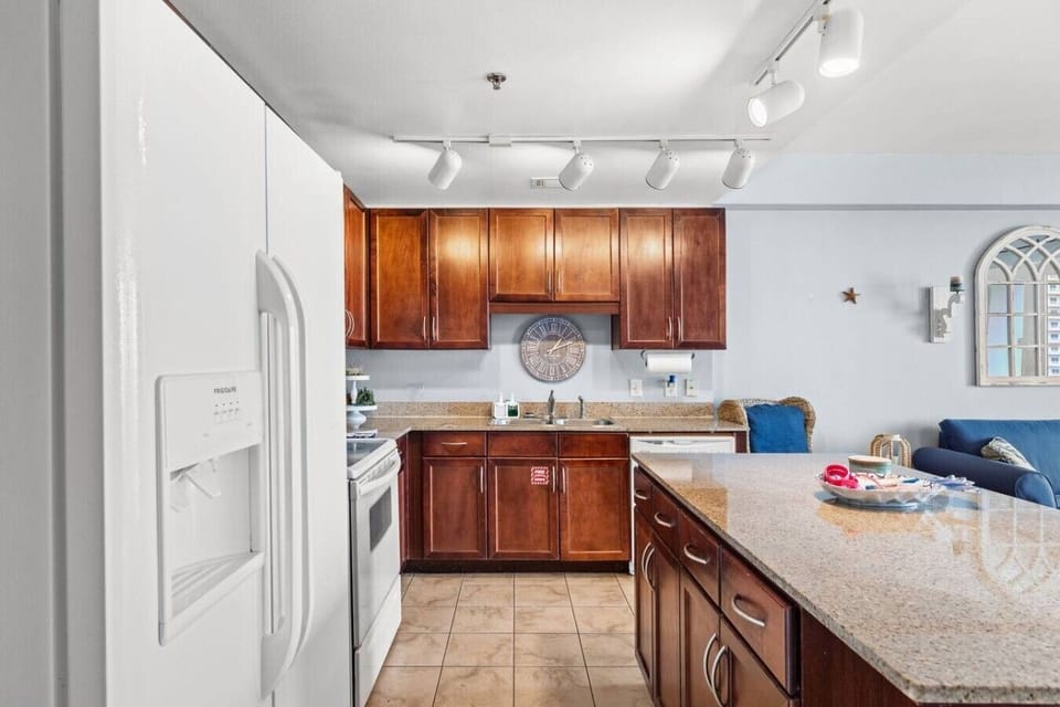 Cook, snack, and connect in the fully equipped kitchen with granite countertops and generous prep space.