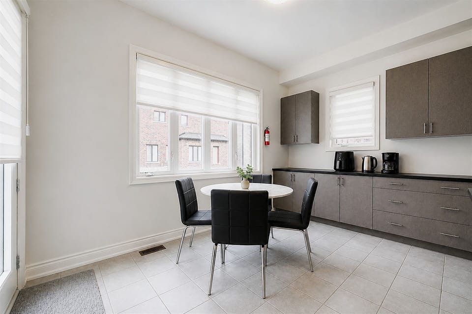 Bright modern dining area with kitchenette and plenty of natural light