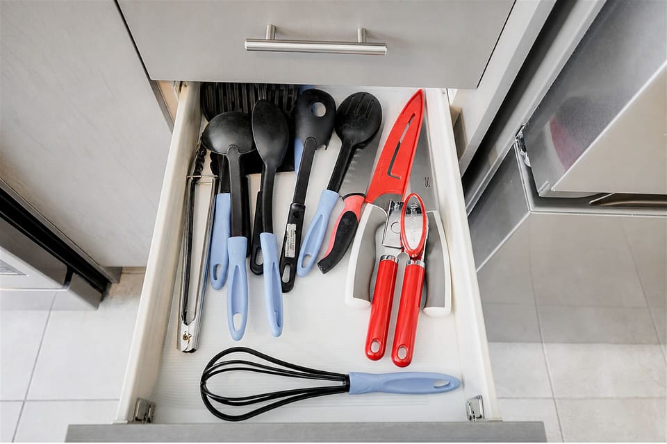 Well-stocked kitchen drawer with essential cooking tools for easy meal prep