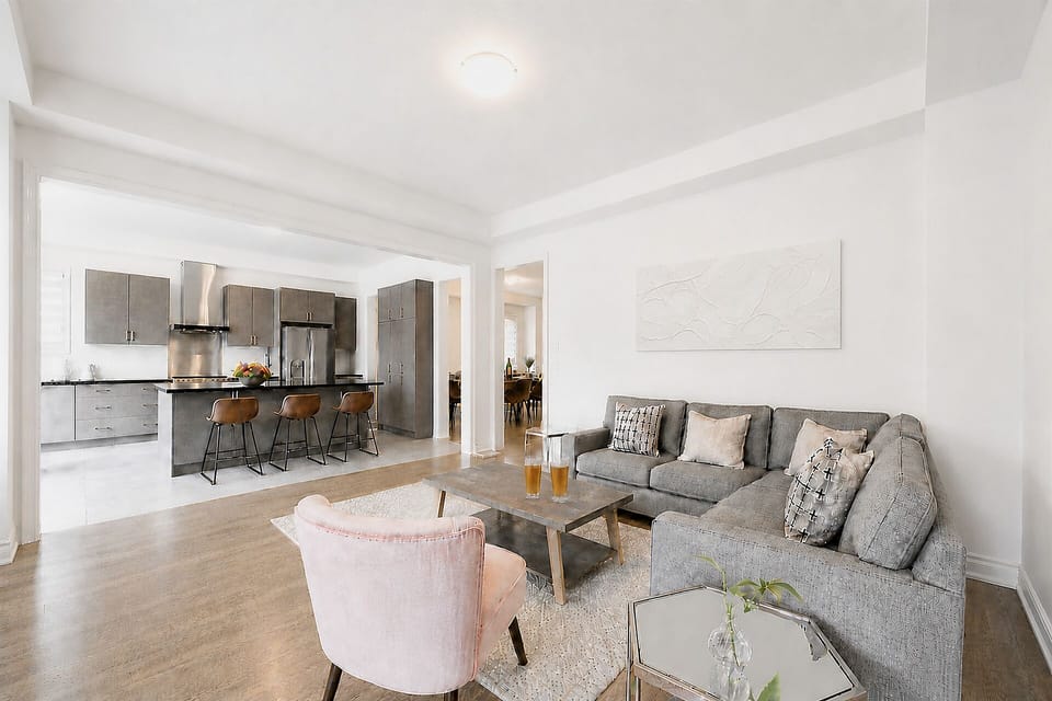Bright open living room with sleek kitchen and stylish bar seating