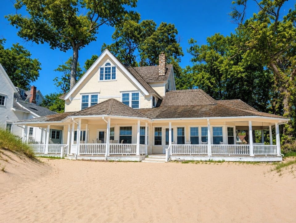 OVERVIEW:  The back of the house, which faces Lake Michigan and has incredible views of Lake Michigan and the Frankfort Lighthouse