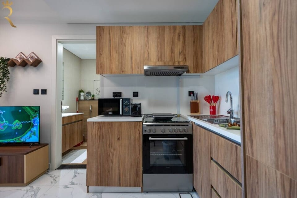 Fully equipped with modern appliances and cookware for easy meal prep.