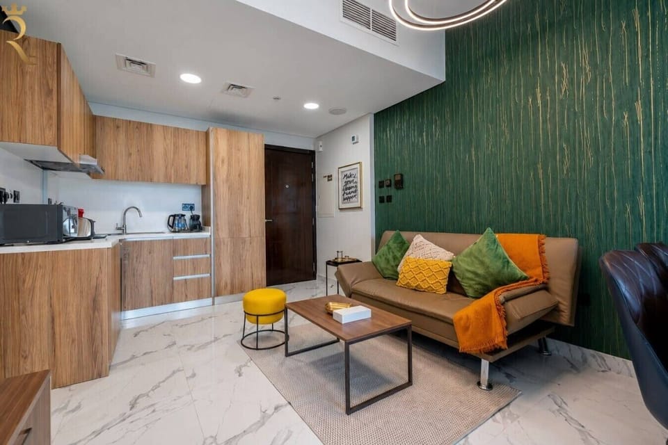 Modern living room with colorful artwork and contemporary furniture arrangement throughout.