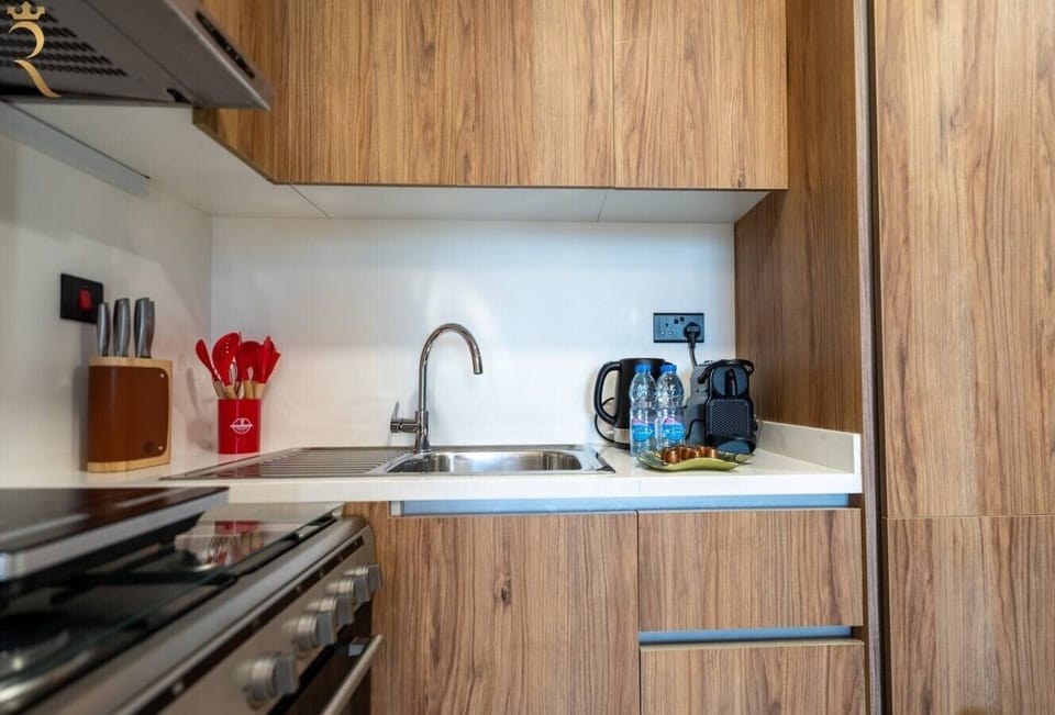 Fully equipped with modern appliances and cookware for easy meal prep.