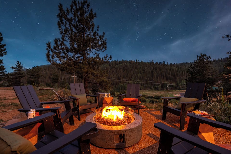 Cozy fire pit seating under the stars with peaceful mountain views