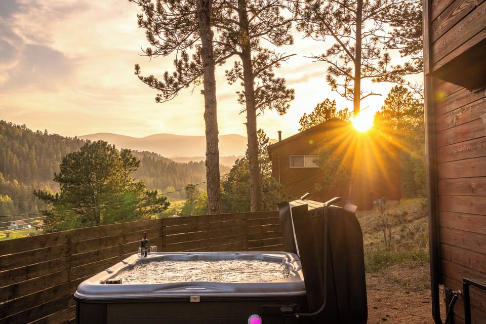 Private hot tub with sunset mountain views in a peaceful pine setting