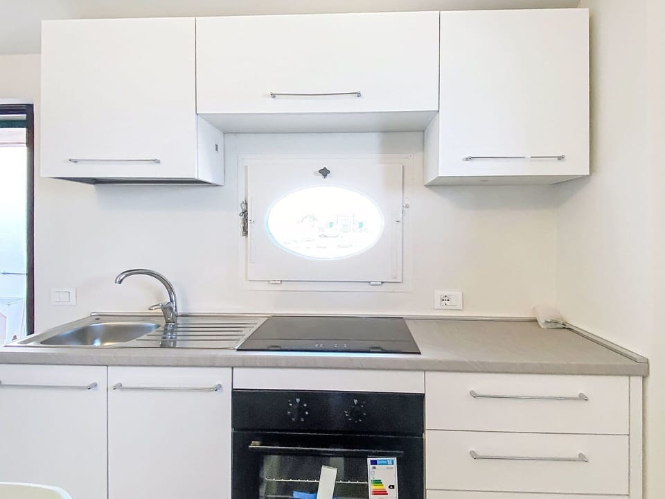 Kitchen, Kitchen Appliance, Countertop, Cabinetry, Major Appliance, Home Appliance, Interior Design, Kitchen Sink, Kitchen Stove, Home