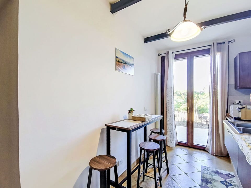 Furniture, Chair, Kitchen & Dining Room Table, Hardwood, Wood Stain, Balcony, Outdoor Table, Wood Flooring, Dining Room, Home Door