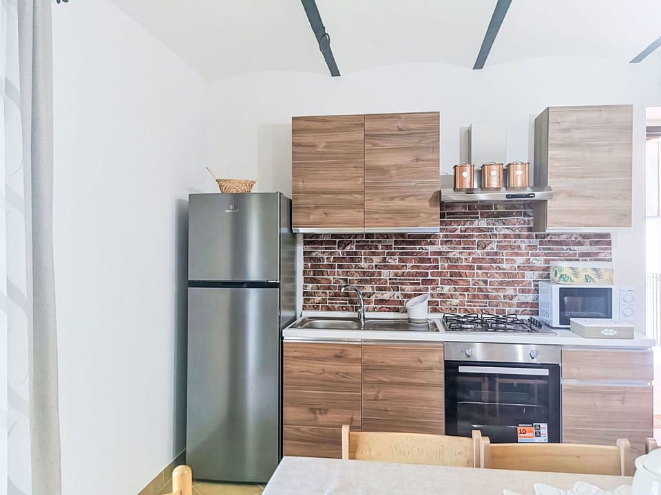 Furniture, Kitchen, Kitchen Appliance, Major Appliance, Countertop, Wood, Interior Design, Flooring, Cabinetry, Floor