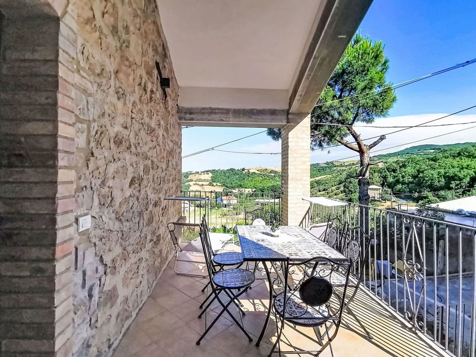 Balcony, Chair, Outdoor Furniture, Handrail, Stone Wall, Fence, Porch