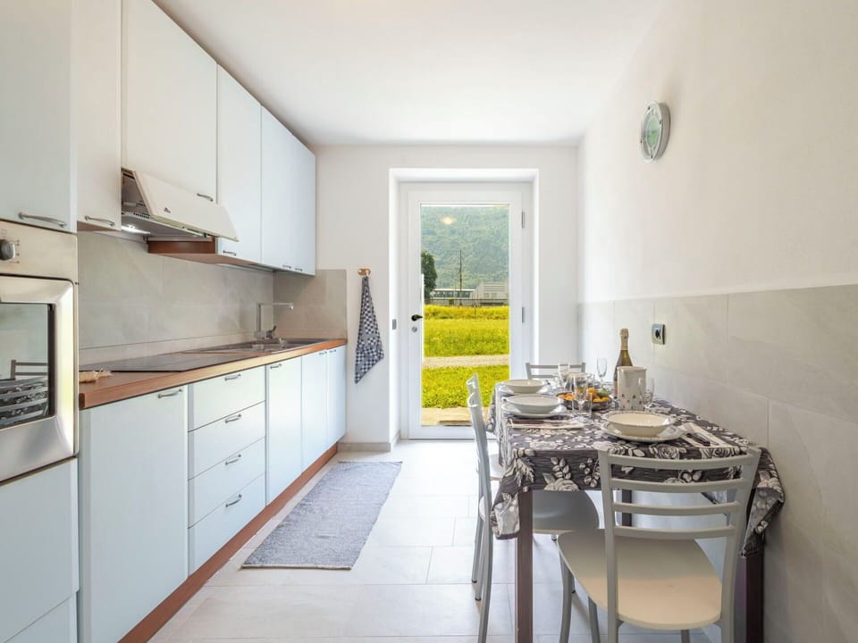 Flooring, Interior Design, Furniture, Floor, Kitchen, Countertop, Ceiling, Room, Kitchen Appliance, Cabinetry