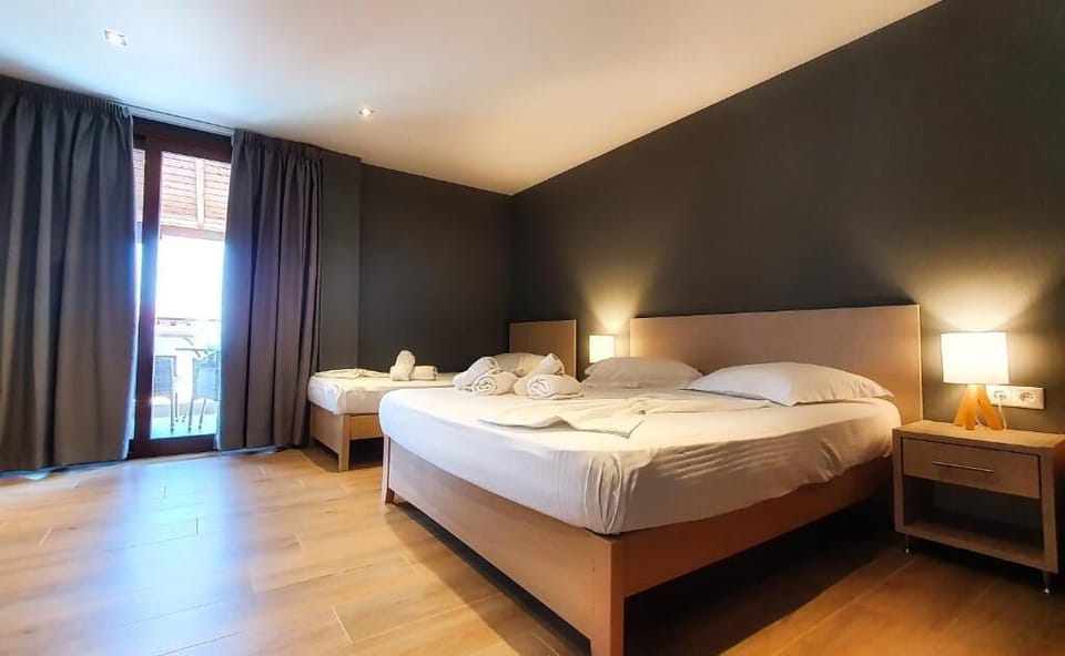 Deluxe Triple Room, Balcony, Sea View | In-room safe, free WiFi