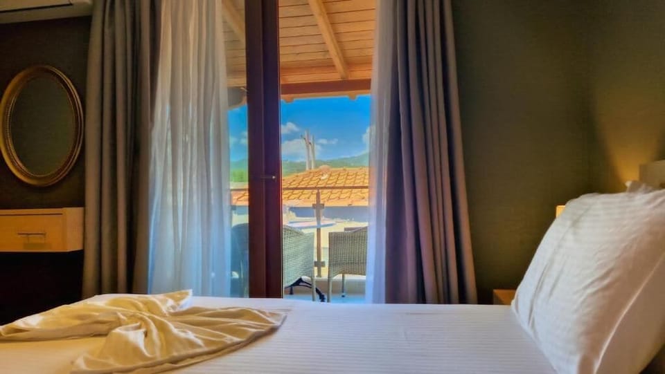 Deluxe Triple Room, Balcony, Mountain View | In-room safe, free WiFi