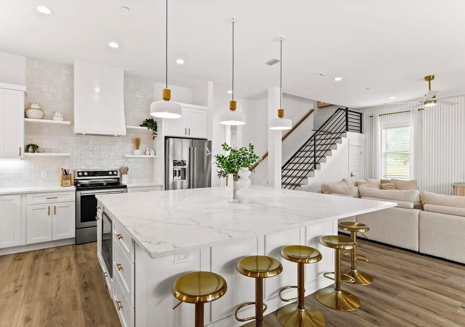 1st Floor - Fully stocked gourmet chef’s kitchen with stainless steel appliances, spacious island seating, and everything needed to prepare meals for large groups. The perfect gathering place for cooking, dining, and making vacation memories together.