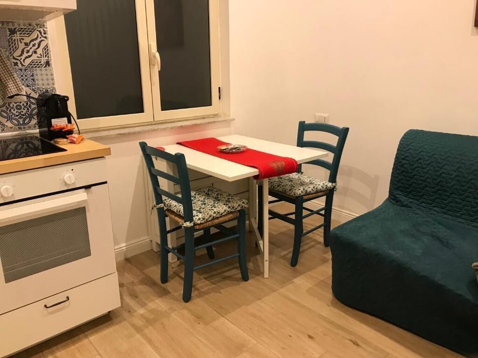 Family Quadruple Room, City View | Dining