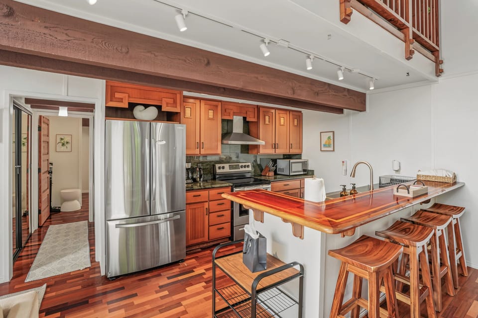 Stocked kitchen with bar seating