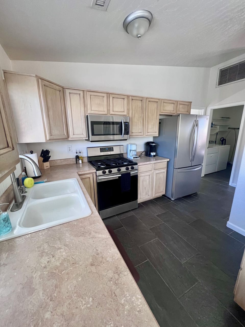 Cooking is a breeze in this fully equipped kitchen, featuring modern appliances and ample counter space.