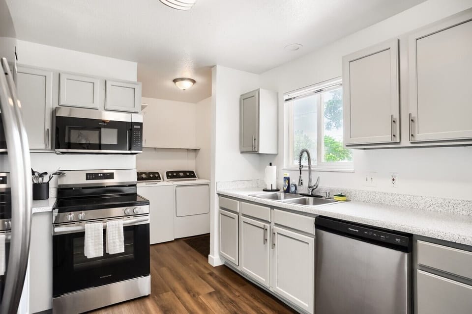 This unit comes with fridge, stove, dishwasher, and microwave