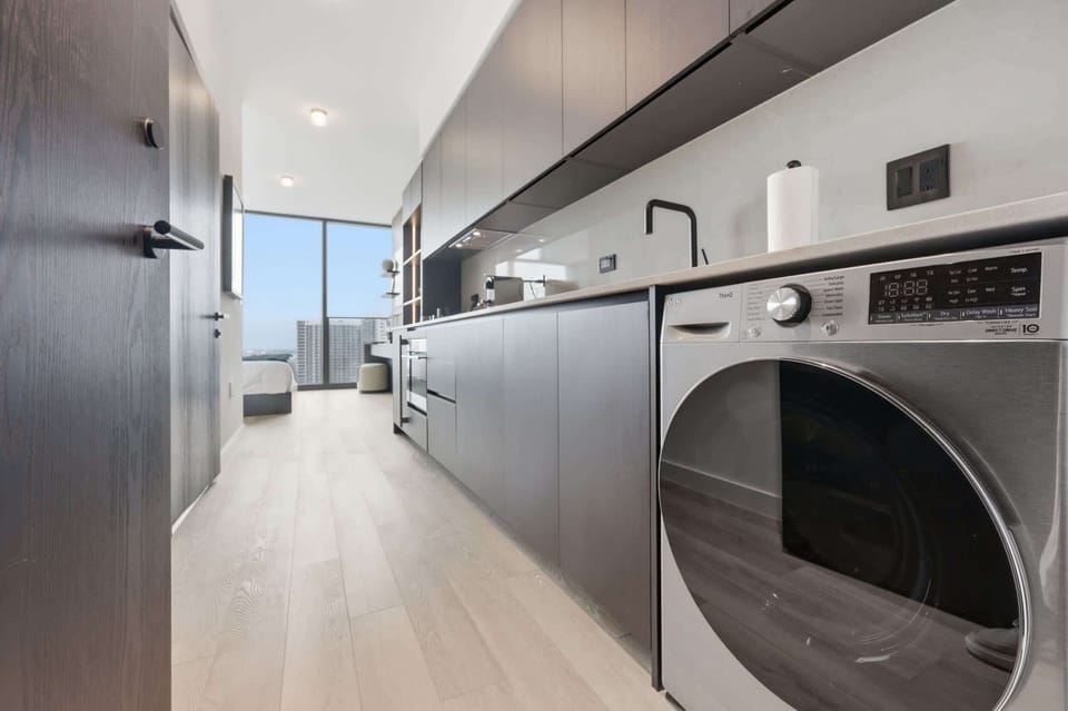 Galley kitchen with an under-counter washer.