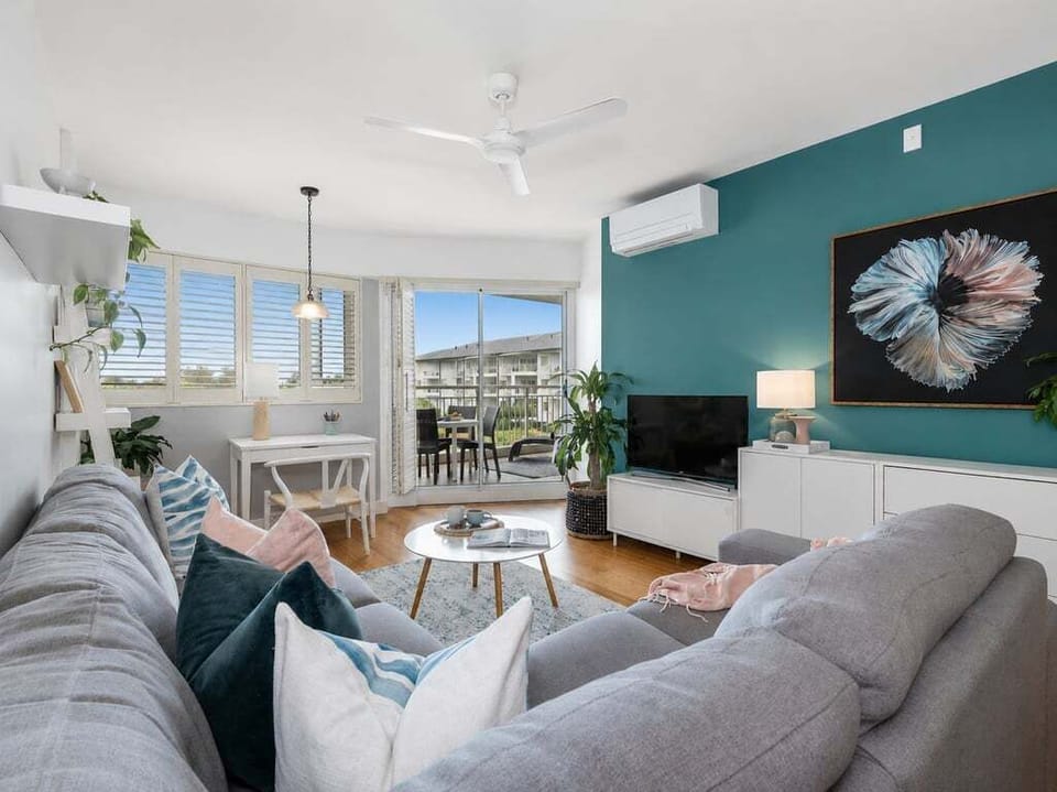 From clocking into work to clocking out for movie night. This living space features a dedicated workspace and a flat-screen setup for ultimate winding down.