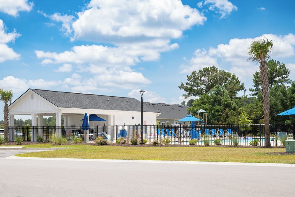 Clubhouse and pavilion area located next to the outdoor amenities.