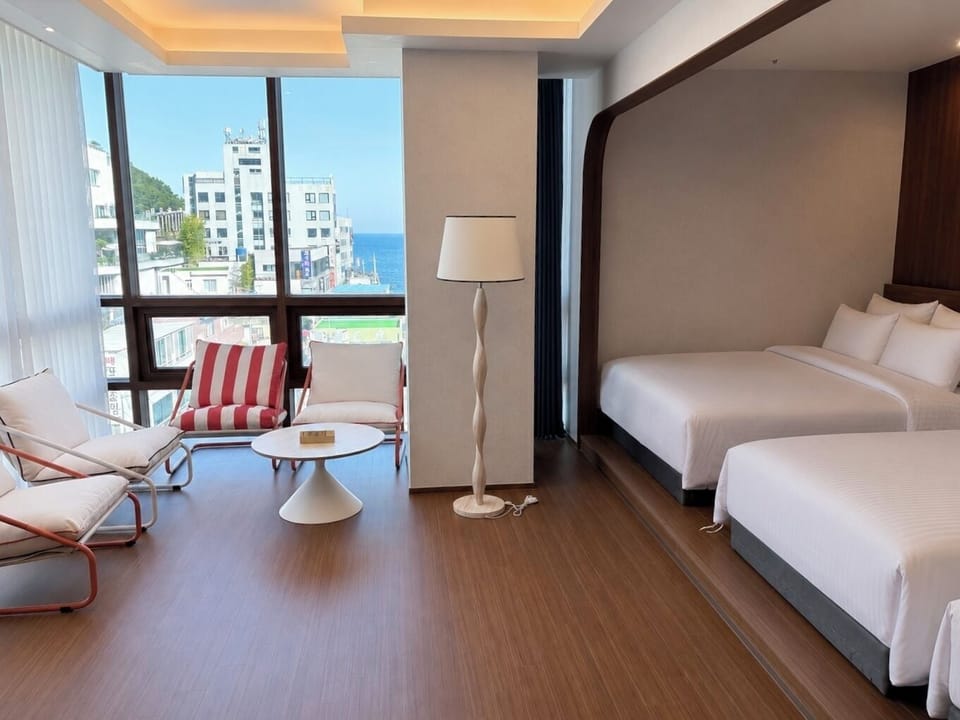 Family Quadruple Room, Non Smoking, Partial Ocean View | Premium bedding, blackout drapes, soundproofing, WiFi (free)