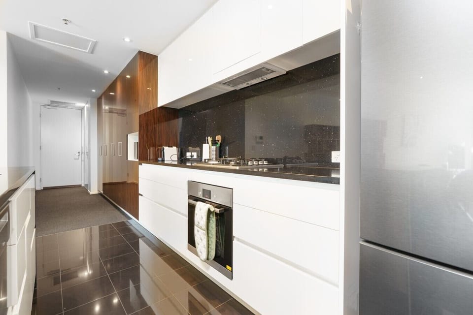 Designed with both style and practicality in mind, this contemporary kitchen offers everything you need for a comfortable stay.