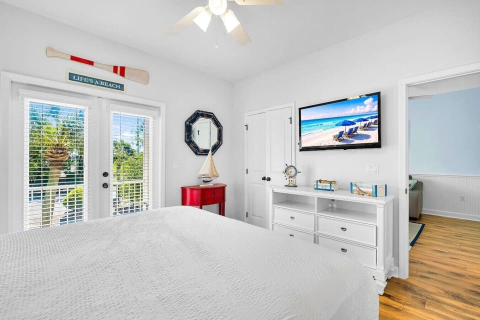 Throw open the French doors and let the palm breeze drift right into your bedroom.