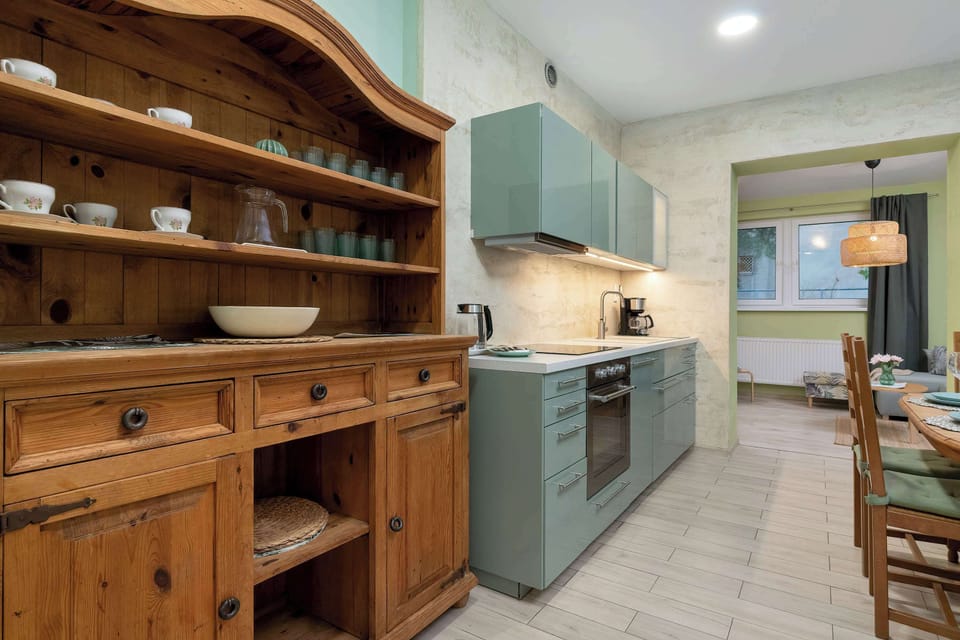 A rustic wooden hutch and cabinetry showcasing traditional craftsmanship. The furniture adds character to the interior.