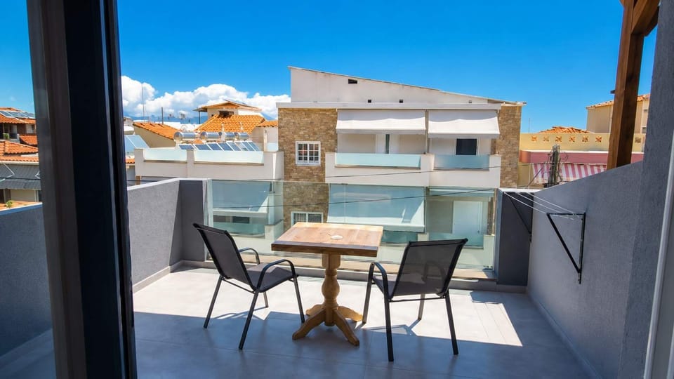 Private Balcony with Outdoor Seating and Neighborhood Views