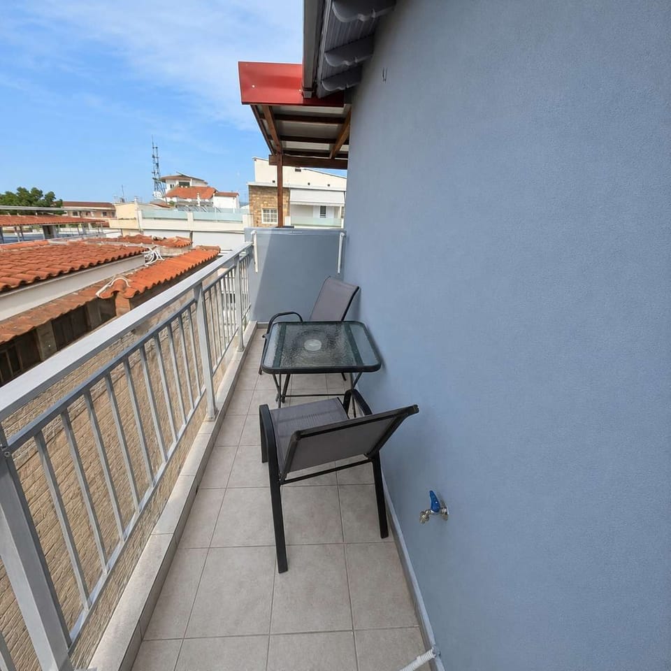 Private Balcony with Outdoor Seating and Neighborhood Views