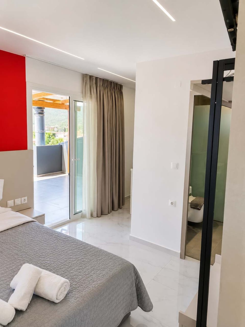 Bright Bedroom with Terrace Access and Contemporary Bathroom